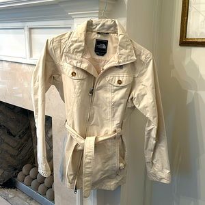 Woman’s cream  North Face jacket with hood to attach. Size small